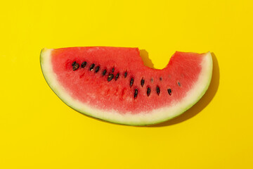 Fototapeta na wymiar Fresh watermelon slice on yellow background. Summer fruit