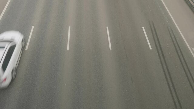 Up view of traffic on the highway with five lanes and lane marking.