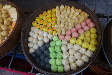Selection of colourful Chinese dumplings in bowl