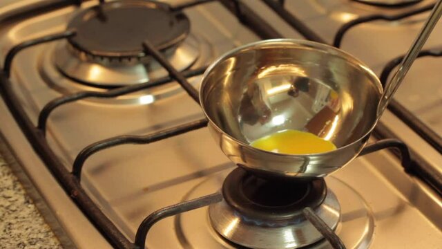 cooking eggs in a ladle and serving a mini omelette