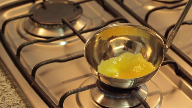 cooking eggs in a ladle and serving a mini omelette