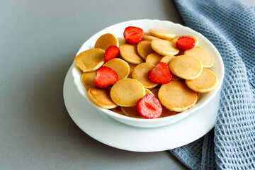 Pancake Cereal In A Bowl With Strawberry
