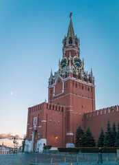 Fototapeta premium Spasskaya Tower of the Moscow Kremlin against the blue sky in Red Square. Russia