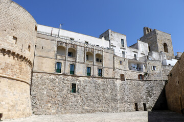 Porta Terra, the entrance to the historic center of Otranto and an Ape Calessino for tourists....