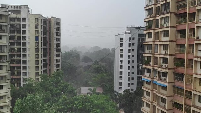 Layers of buildings followed by nature in the background