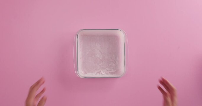 preparing a glass bowl with flour