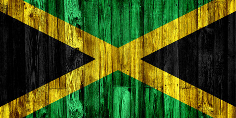 Flag of Jamaica painted on grungy wood plank background