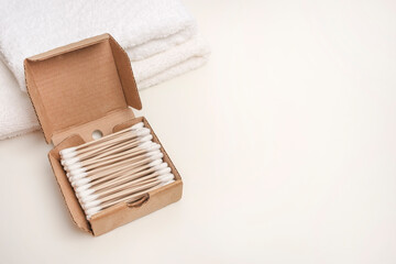 Natural accessories for personal hygiene. Plastic rejection concept and zero waste. Set of bamboo ear sticks on a white background with copy space.