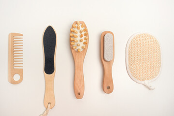 Eco set of bath accessories and massage brushes. Zero waste concept. Wooden brushes, comb and washcloth made of natural material.