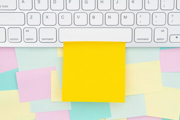 Computer keyboard with sticky note and multi-color notes