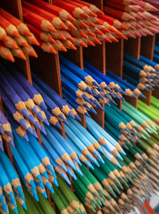 colored pencils in a row on the shelves. Creativity concept. Pencils in  stationery shop.