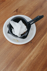 Plastic dishes after use. Food in plastic dishes in a cafe is a new reality during the coronavirus pandemic. Harmful to the environment