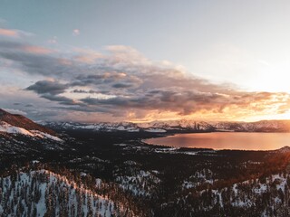 Aerial view of the beautiful Lake Tahoe captured on a snowy sunset in California, USA