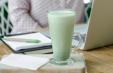 woman cup green matcha latte coffee tea glass work place cafe terassa home freelancer