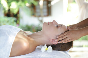 Obraz na płótnie Canvas Face massage, a woman in the spa having anti-age face massage 