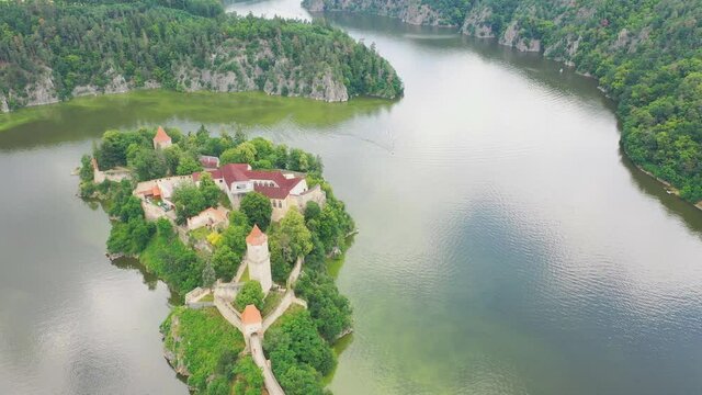 Aerial view on czech medieval castle Zvikov, situated on rocky outcrop above the confluence of two rivers Vltava and Otava, Czech republic
