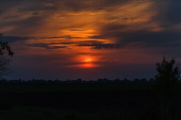 Sunset, bright colors in the sky and with clouds