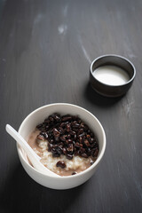 Thai sweet sticky rice with black beans in coconut milk