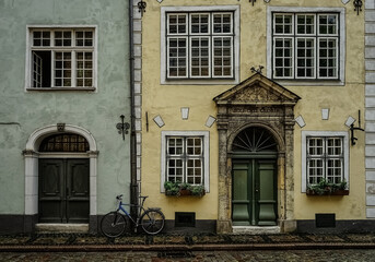 old town architecture with bicycle leaning against house wall   