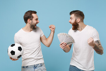 Crazy two men guys friends in white t-shirt isolated on blue background. Sport leisure lifestyle...