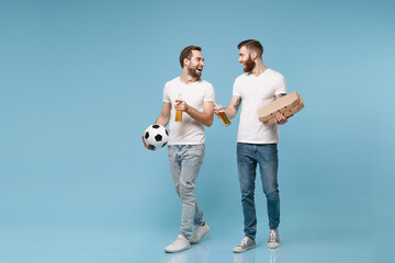 Laughing men guys friends in white t-shirt isolated on blue background. Sport leisure concept. Cheer up support favorite team with ball, beer bottle, pizza in cardboard flatbox, looking at each other.