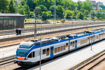  Suburban train on the city platform.