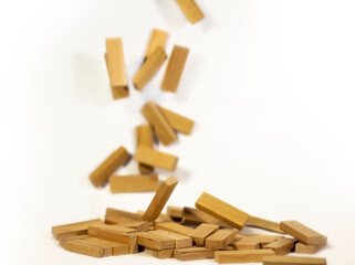 wooden game blocks raining from above stacking on ground