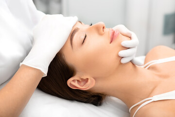 Beautiful woman, with smooth, shiny skin and a clean face, after peeling and skin rejuvenation at the beautician