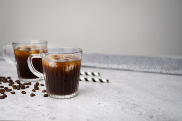 ice black coffee. cold refreshment with paper straw.