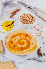 Healthy breakfast with homemade hummus on white wooden background. Diet and Healthy snack food