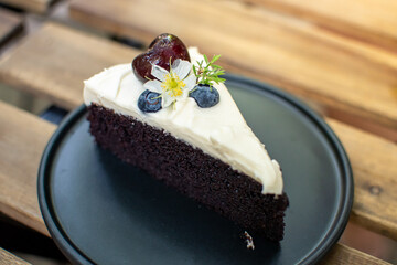dark chocolate cake on wooden table