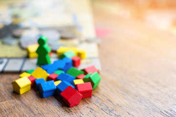 colorful wooden component of board game on game map