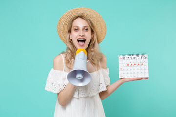 Excited young woman girl in white dress hat hold periods calendar for checking menstruation days...