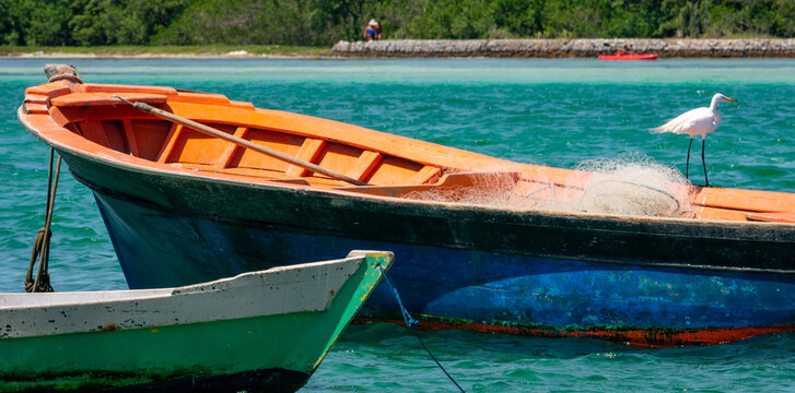 old fishing boat in a tropical colorful scenario