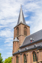Fototapeta premium Tower of the protestant gothic church of the little Dutch village Rechteren in Overijssel, Netherlands, Europe
