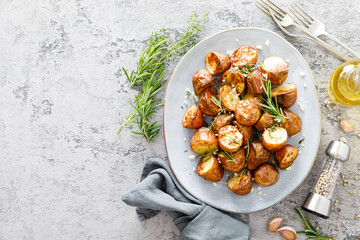 Baked potatoes with rosemary, thyme and garlic