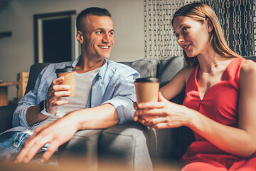 Happy couple chatting and enjoying time in cafe