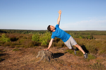 Fototapeta premium Man working out in the countryside