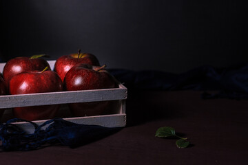 red apples ready to sell, delicious, harvested with a lot of dedication in a wooden box