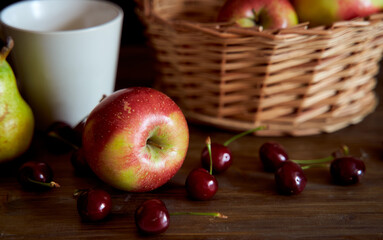 Braided basket with red apples on a black background