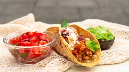 Mexican traditional authentic homemade tacos with pulled pork beef chili con carne serve with...