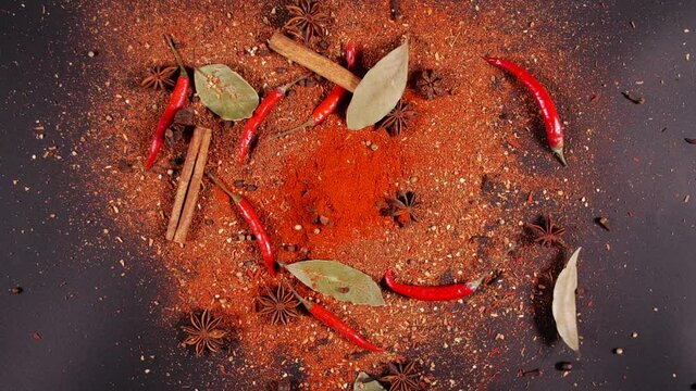 Exotic Spices and chilli pepper Flying up and Falling down in Slow Motion