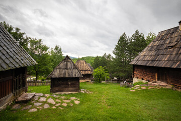 Fototapeta na wymiar Old wooden rustic idyllic houses in a Sirogojno village on Zlatibor mountain in Serbia.