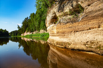 Fototapeta na wymiar Sand cliff Sietiniezis on the Gauja river banks in Vaidava, Latvia