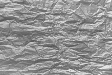 Gray crumpled paper abstract art background. Wrinkled texture effect
