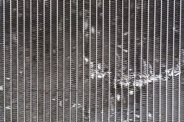 close up the damage of car cooling radiator. The old radiator of the damaged car. 