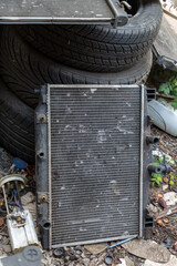 close up the damage of car cooling radiator. The old radiator of the damaged car. 