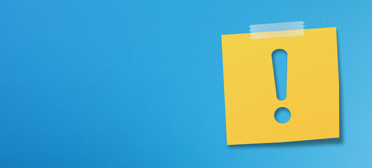 Yellow sticky note paper with exclamation mark on blue background