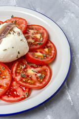 Healthy Homemade Tomato Salad with Mozzarella, Anchovies and Oregano