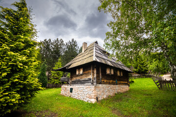 Fototapeta na wymiar Old wooden rustic idyllic houses in a Sirogojno village on Zlatibor mountain in Serbia.